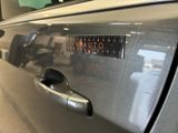 a close up of a car door handle with a sticker on it
