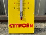 a yellow thermometer with the word citroen on it