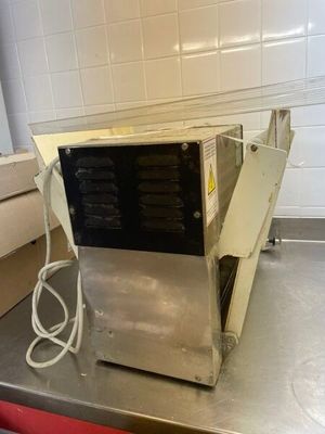 a machine that is sitting on a counter in a kitchen