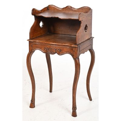 an old wooden desk with a drawer on it