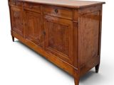an image of a wooden sideboard with drawers