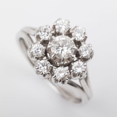 an image of a diamond cluster ring on a white background
