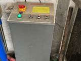 a machine that is sitting in the corner of a room