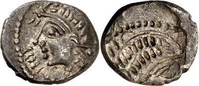 a silver coin with an image of a woman on it