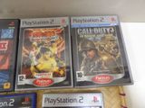 three video games sitting on a table next to each other