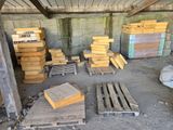 a pile of wooden pallets in a building