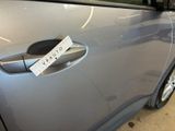 a sticker on the door handle of a car