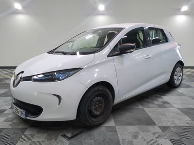 a picture of a white car parked in a garage
