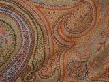 an image of a close up of a paisley pattern on fabric