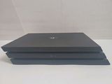 a black laptop sitting on top of a white table