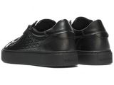 black leather sneakers with monogram print and rubber soles