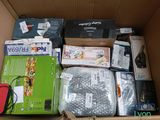 a cardboard box filled with many different types of electronic equipment