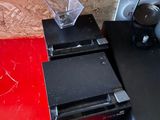 a laptop computer sitting on top of a desk next to a printer