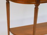 a small wooden table with a shelf underneath it