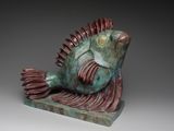 a sculpture of a fish that is sitting on a table