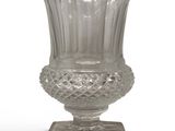 a glass vase that is sitting on a stand