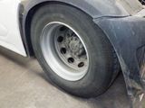 a close up of a tire on the side of a truck