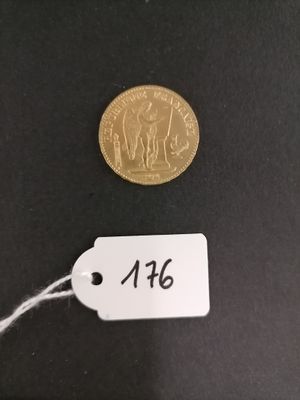 a close up of a coin with a price tag attached to it