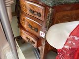 a table with two vases on top of it in a room
