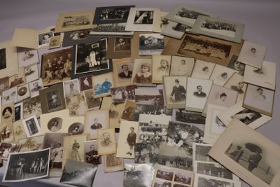 a lot of old photos of people on the table