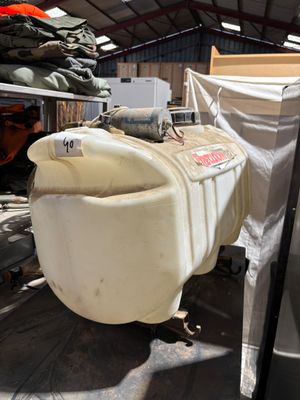 a large tank sitting in the back of a truck