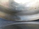 a metal bowl with a metal lid on a table