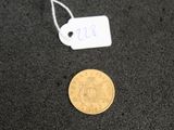 a close up of a coin with a price tag on it