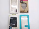 packaging for a cell phone and a box of other items on a white surface