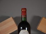 a bottle of wine that is sitting on a table
