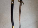two knives that are on the table next to each other