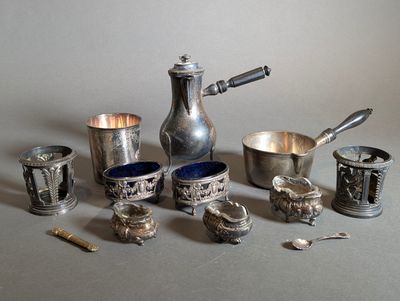 many silver items that are sitting on a table