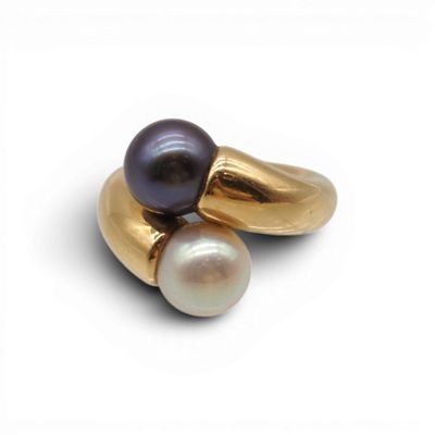 an image of a close up of a ring with two pearls on it