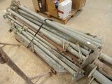 a pile of metal pipes sitting on the ground