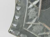 a silver plate with a decorative design on it