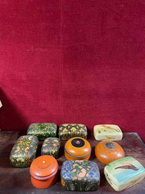 many different types of boxes and containers on the table