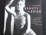 la couverture du livre *Beauty in Exile*, sur laquelle figure une femme en robe sans bretelles