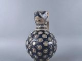 an image of a vase with a cat on top of it