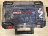 a plastic tool box with a screw and screwdriver inside of it