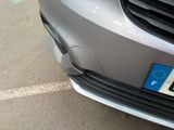 a close up of a car ' s grille with a european flag on it
