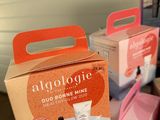 several boxes of skin care products sitting on top of a table