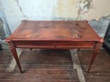 a small table with a drawer on top of it