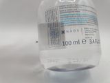 a close up of a bottle of water on a table