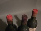 three bottles of wine sitting next to each other on a table