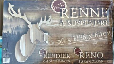 a picture of a wooden sign with a deer head on it