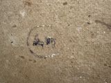 a picture of a face drawn on the wall of a bathroom