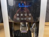 a coffee machine that is sitting on a wooden table