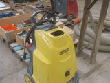 a yellow machine that is sitting on the ground