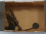 several pairs of scissors in a box on a tile floor