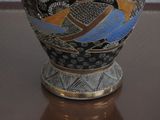 a vase that is sitting on a table in a room