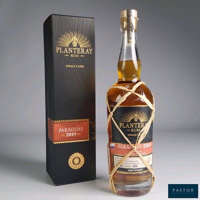 an image of a bottle of whisky next to a box